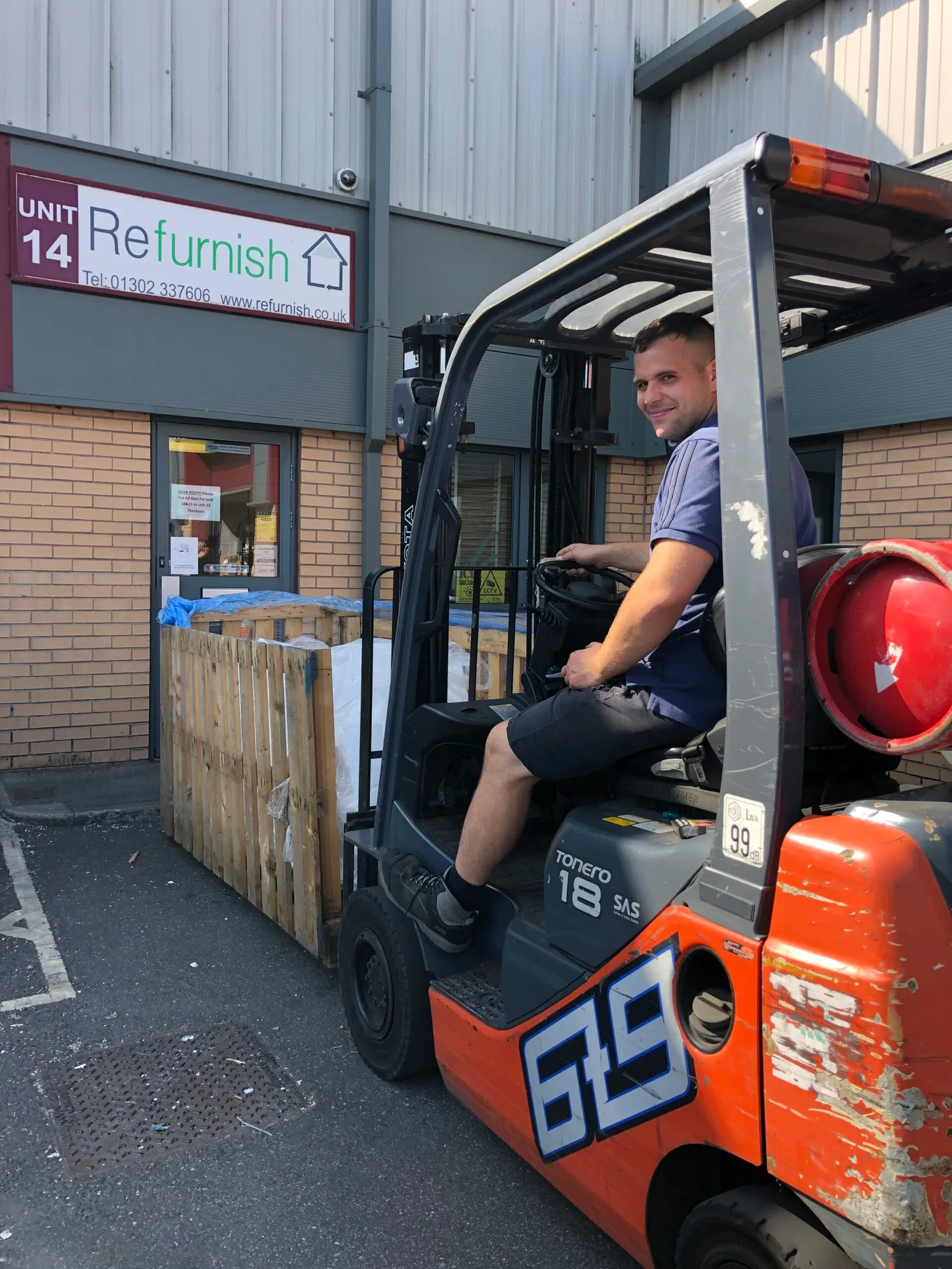 A forklift moving a pallet of goods outside the Doncaster Refurnish warehouse unit