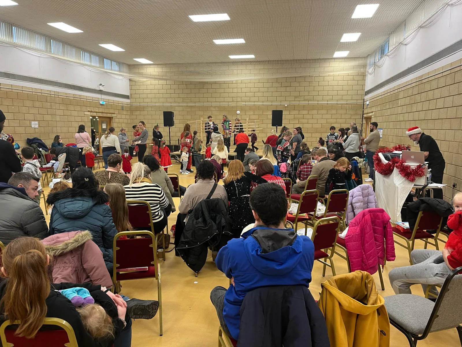 A community event in a Doncaster hall, tables and chairs set out for guests