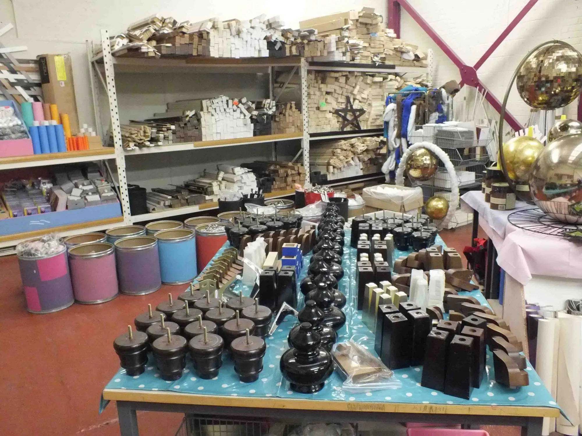 Shelves of glassware and crockery arranged for sale in a Doncaster Refurnish shop