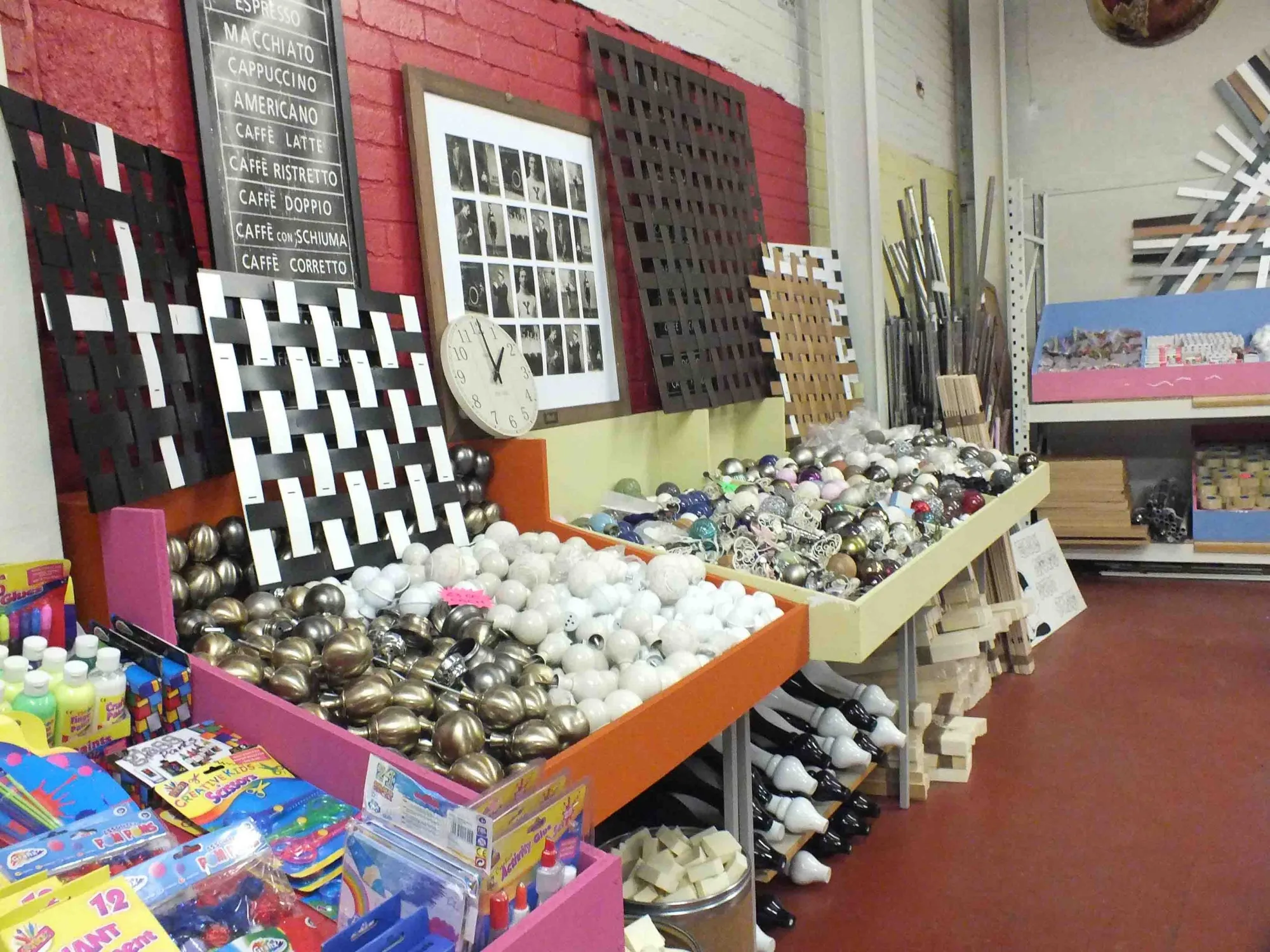 A wall of homeware, pictures and small furniture displayed in a Doncaster Refurnish shop