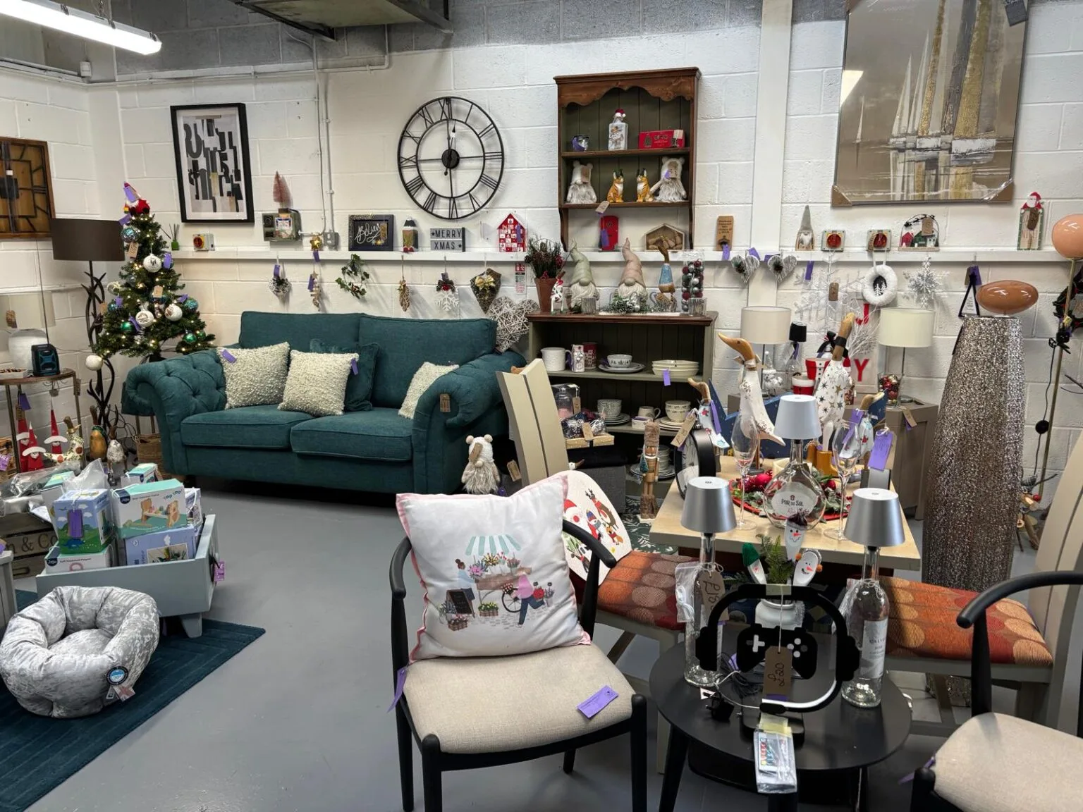 A Doncaster Refurnish shop dressed for Christmas, with decorated displays across the floor