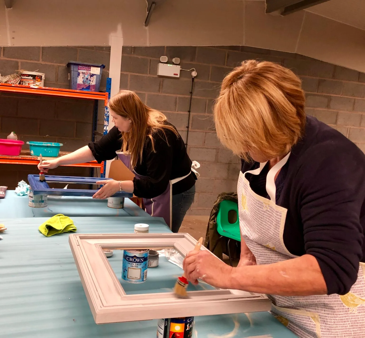 People painting picture frames together at a Doncaster Refurnish upcycling workshop